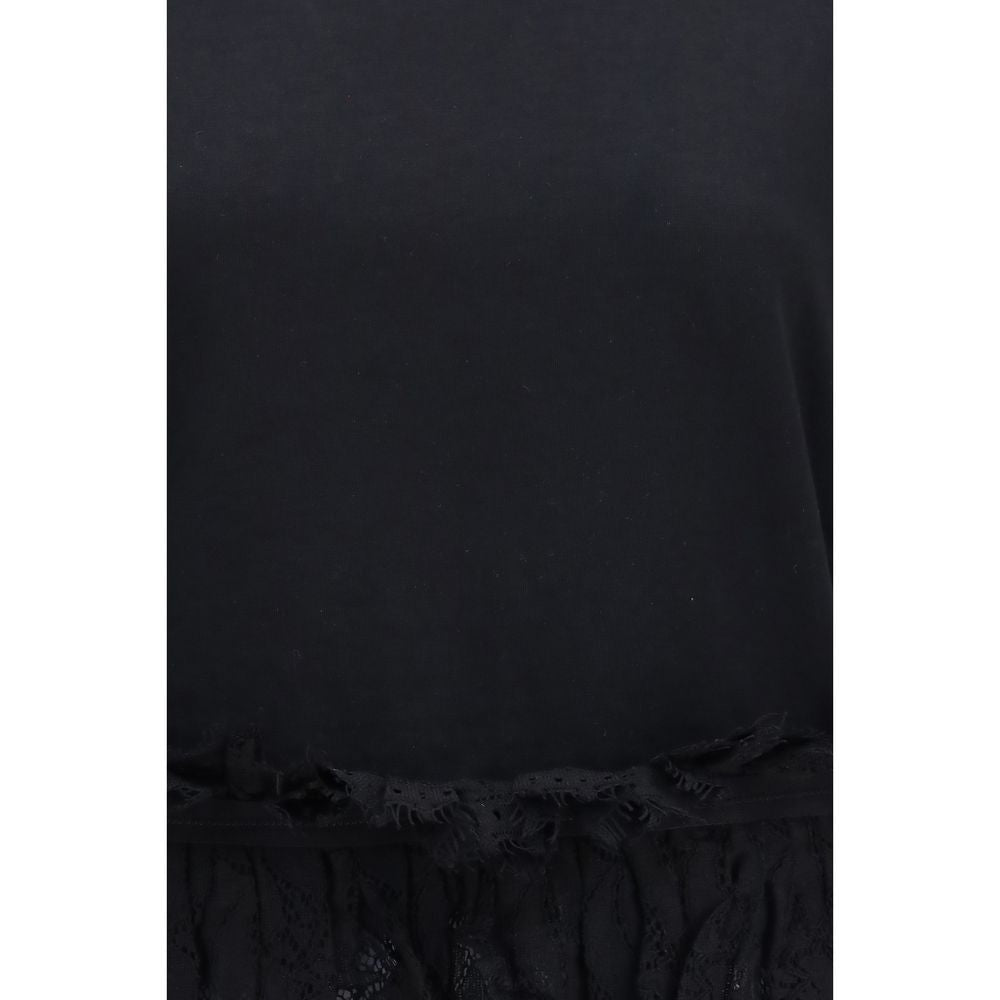 Elevate your wardrobe with the Alexander McQueen Black Cotton T-Shirt, featuring exquisite lace ruffle detailing and a refined silhouette that embodies timeless luxury.