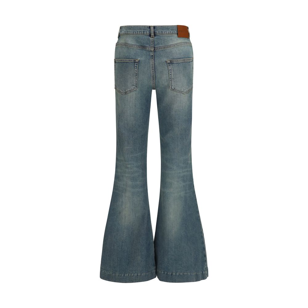 Discover the allure of Alexander McQueen's Blue Cotton Flared Jeans, where exquisite craftsmanship meets a timeless silhouette, perfect for the discerning individual.