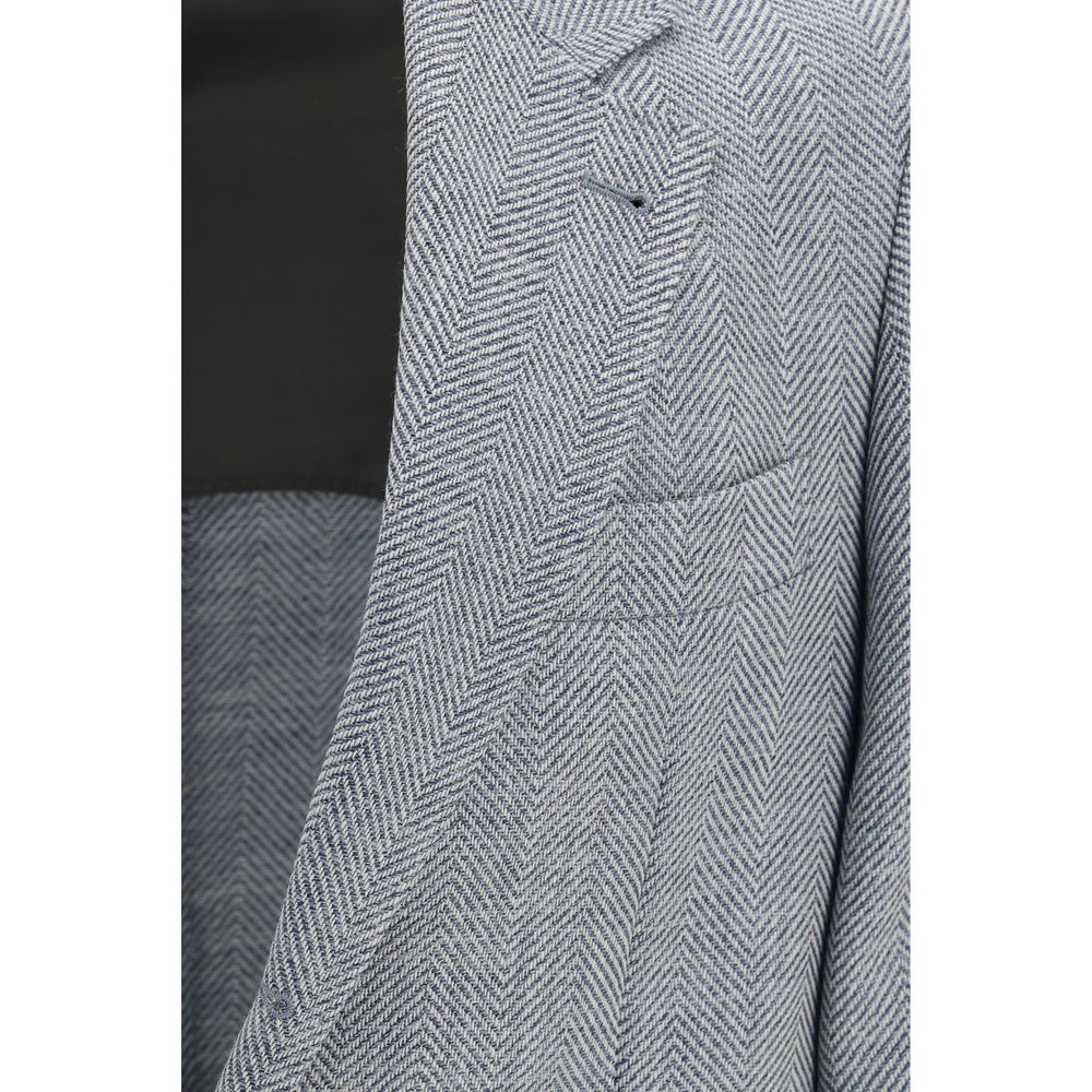 Experience the exquisite allure of the Brunello Cucinelli Gray Wool Oves Aries Blazer, where deconstructed luxury meets timeless craftsmanship in a sophisticated blend of wool, alpaca, and silk.