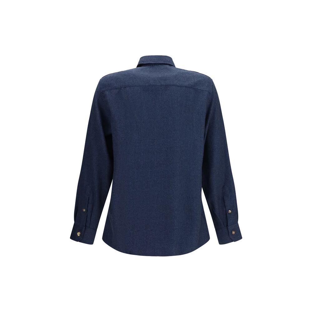 Discover the Brunello Cucinelli Blue Wool Oves Aries Shirt, a masterpiece of 100% Merino Wool, exuding refined elegance and timeless sophistication for the discerning individual.