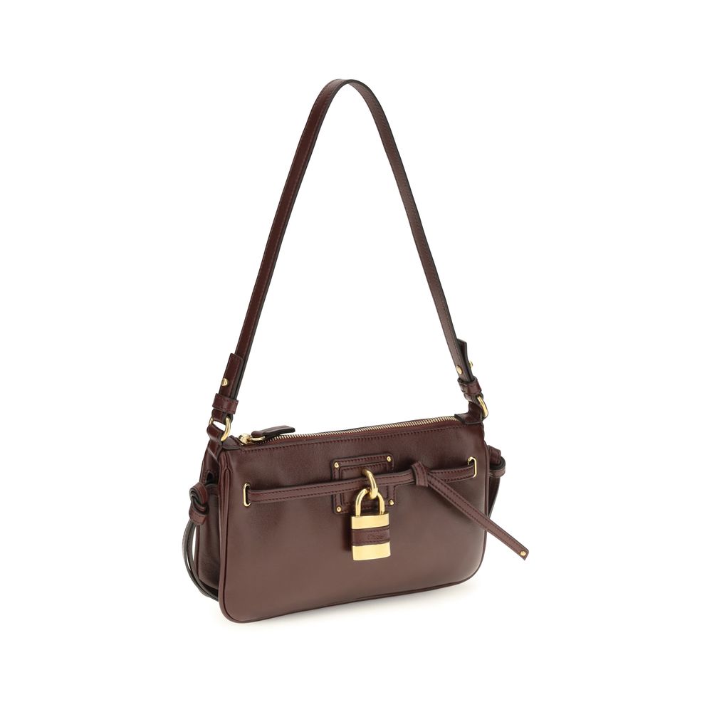 Elevate your style with the Chloé Bordeaux Calf Leather Bos Taurus Shoulder Bag, a masterpiece of craftsmanship and design, perfect for the discerning individual.