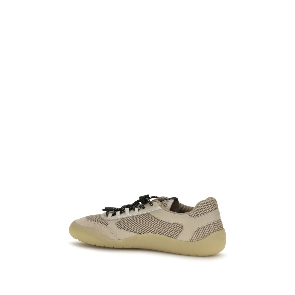 Experience the allure of Prada's Beige Calf Leather Bos Taurus Athletic Sneakers, where dynamic design meets exquisite craftsmanship for a statement of luxury and sophistication.