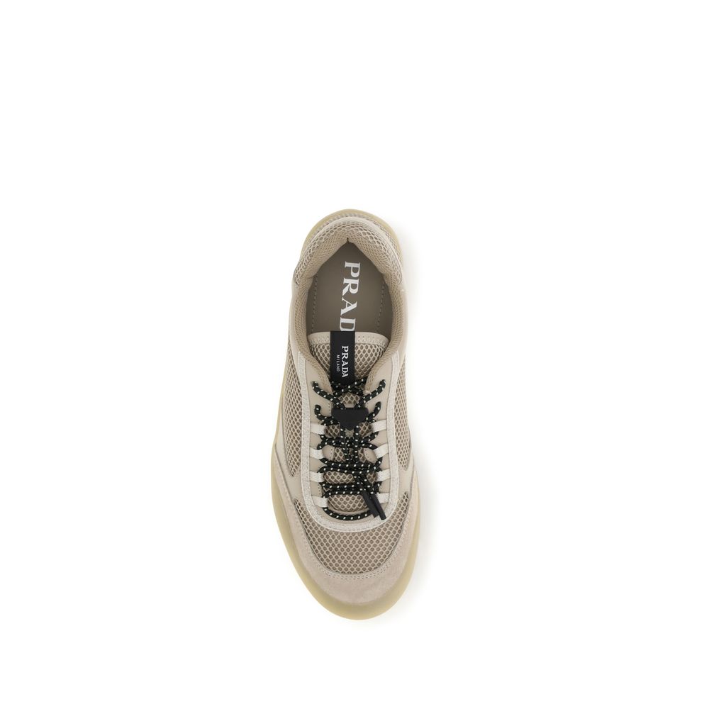 Elevate your style with Prada's Beige Calf Leather Bos Taurus Athletic Sneakers, where dynamic design meets luxurious craftsmanship for the discerning individual.