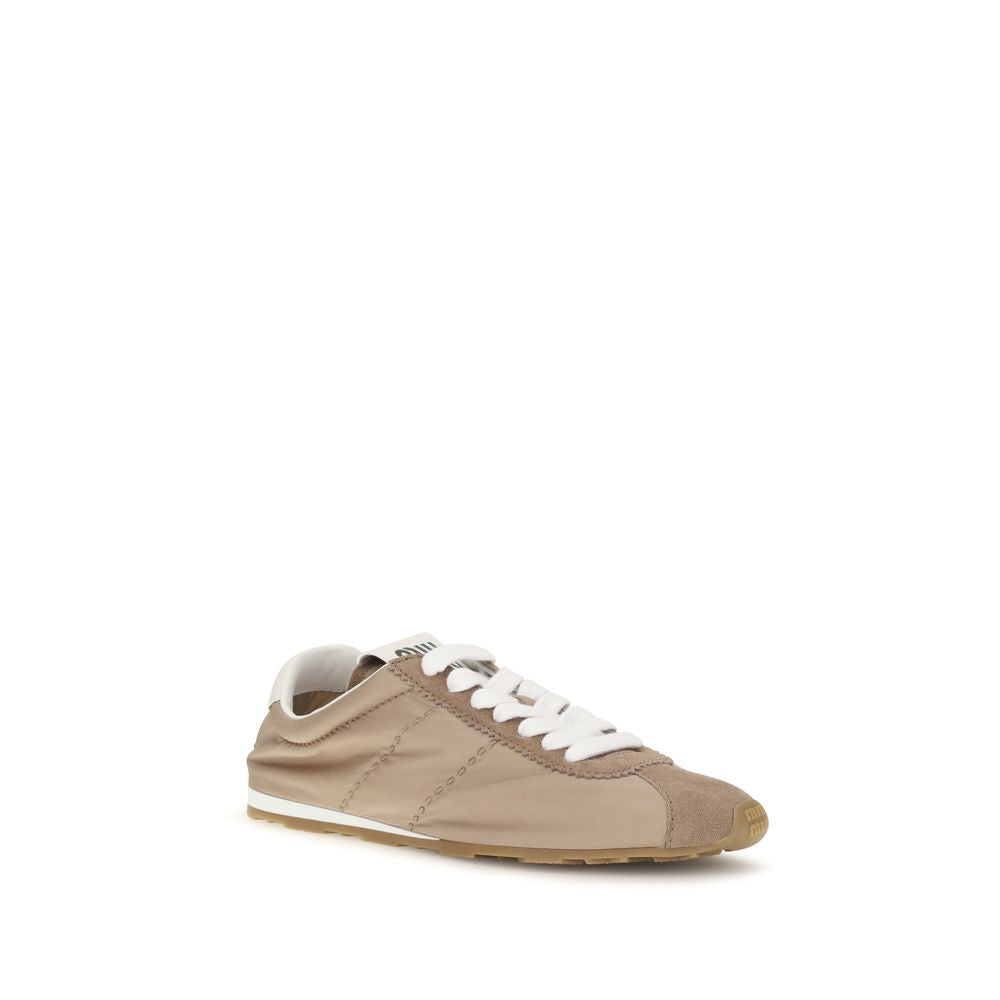 Indulge in the elegance of Miu Miu's Beige Calf Leather Bos Taurus Low Top Sneakers, where refined craftsmanship meets sophisticated style for the modern connoisseur.
