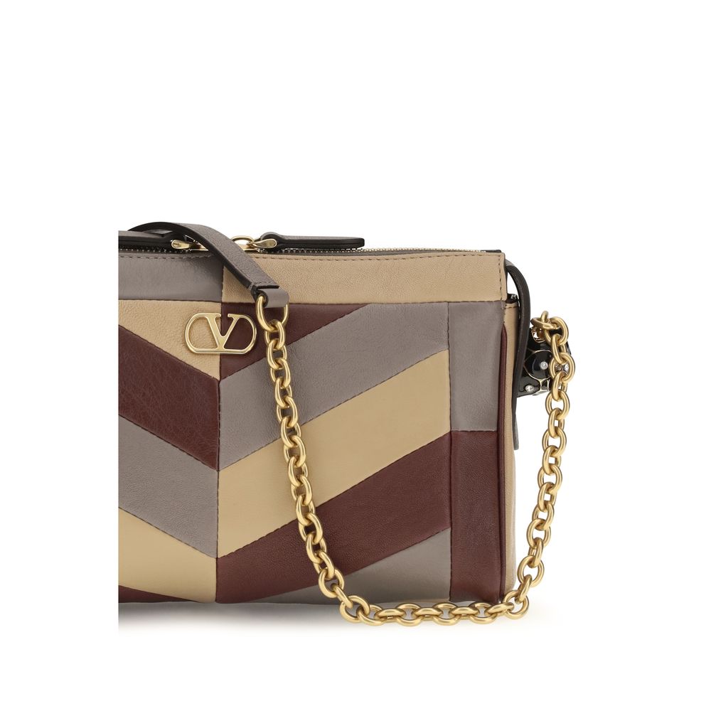 Indulge in the exquisite Panthea Chevron nappa Shoulder Bag by Valentino Garavani, a masterpiece of patchwork luxury, adorned with Swarovski® crystals and timeless elegance.