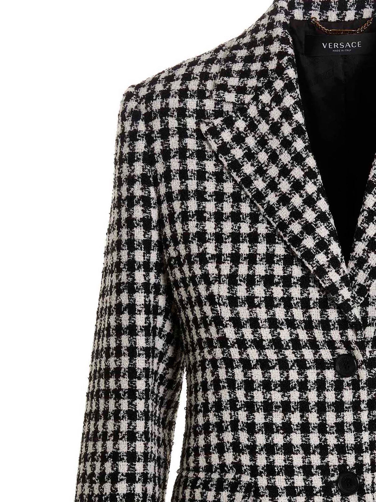 Elevate your wardrobe with the Versace Bicolor Virgin Wool Blazer, a masterpiece of luxurious craftsmanship that embodies sophistication and timeless elegance.