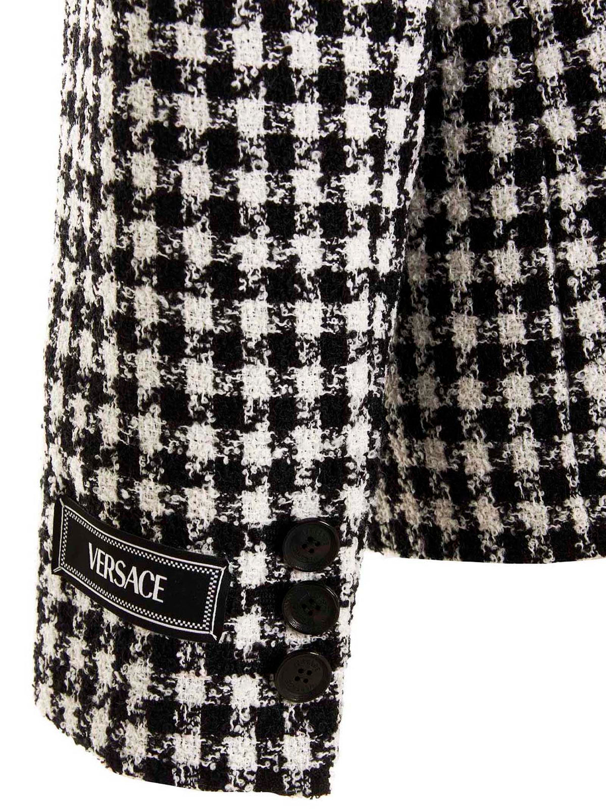 Elevate your wardrobe with the Versace Bicolor Virgin Wool Blazer, a masterpiece of Italian craftsmanship that embodies sophistication and timeless elegance for any occasion.