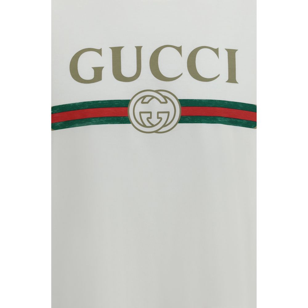 Elevate your wardrobe with the Gucci White Cotton T-Shirt, a silk-blend masterpiece that embodies timeless elegance and the iconic House signature.