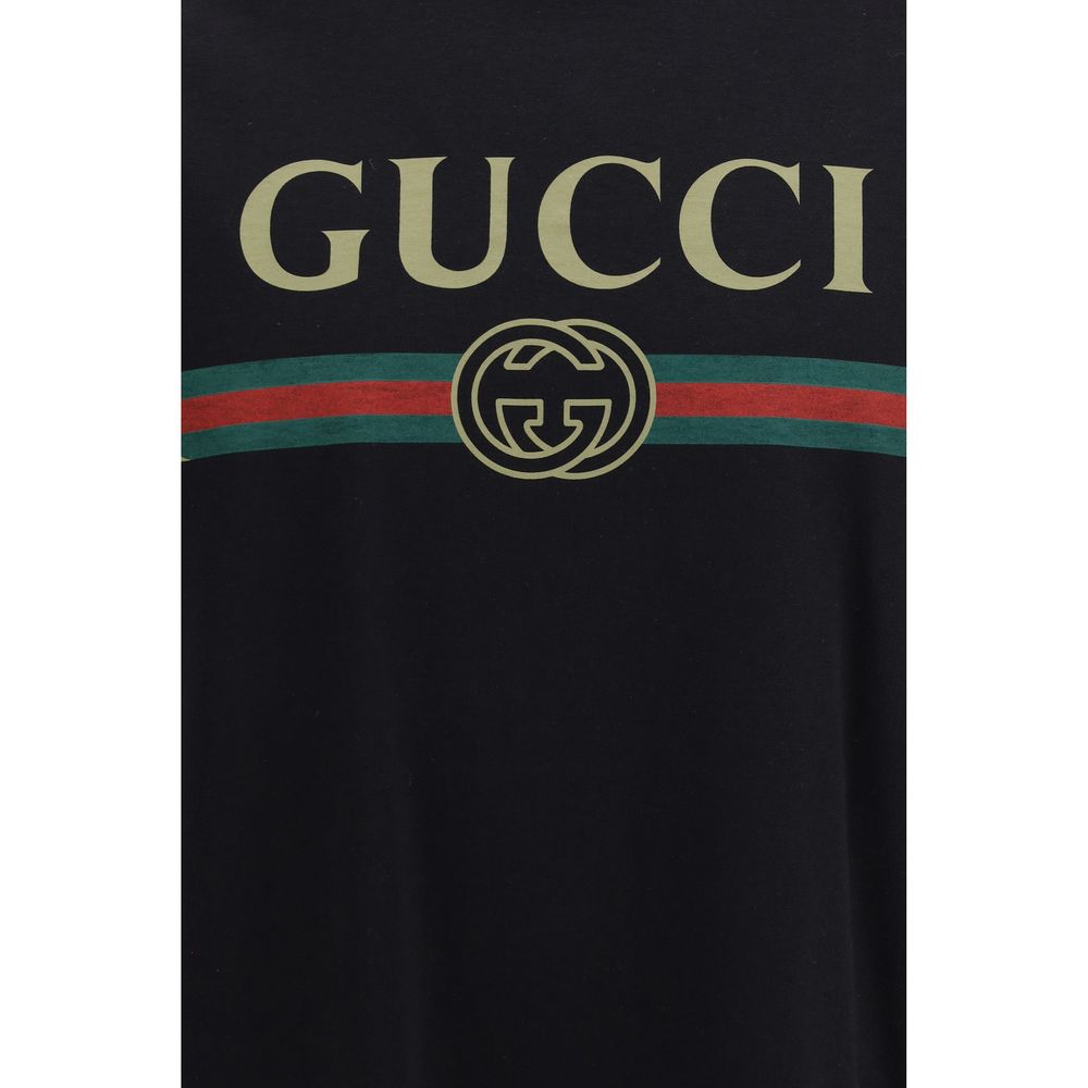 Indulge in the allure of the Gucci Black Cotton T-Shirt, a masterpiece of silk-blend craftsmanship, embodying timeless elegance and iconic style for the discerning individual.