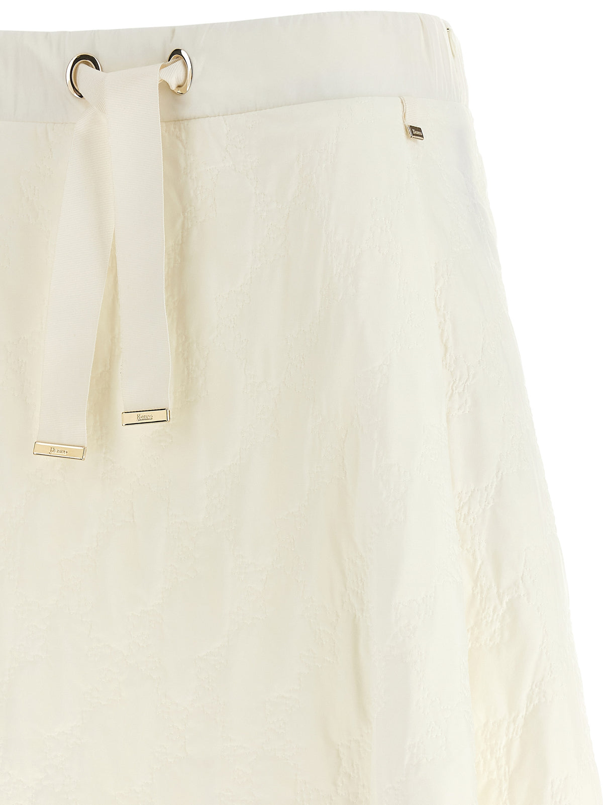 Elevate your wardrobe with the Herno White Polyamide Mini Skirt, a masterpiece of Italian craftsmanship featuring a luxurious flared silhouette and chic water-repellent finish.