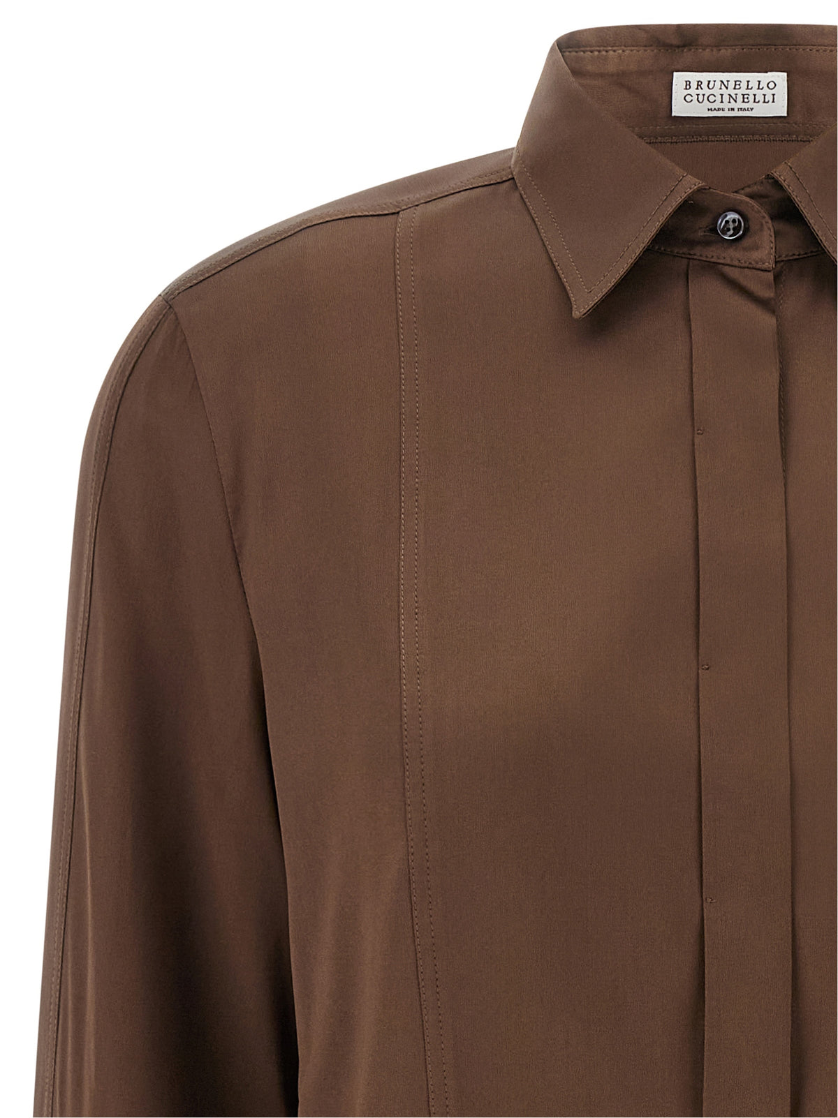 Indulge in the exquisite Brunello Cucinelli Brown Silk Blouse, a luxurious blend of stretch silk satin and architectural design, embodying elegance and sophistication for the discerning individual.