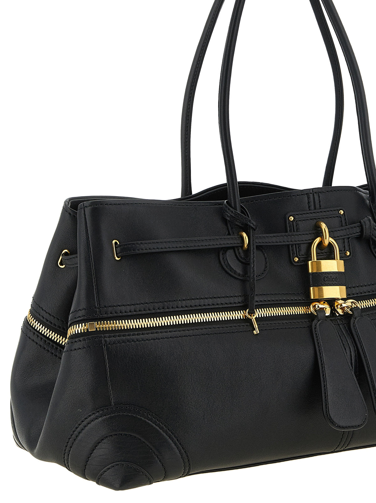 Discover the Chloé Paddington Sling, a luxurious black lamb leather shoulder bag that redefines sophistication with its exquisite craftsmanship and iconic design.