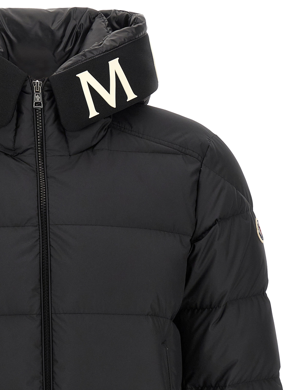 Discover the Moncler Black Polyester Full-Length Jacket, a masterful blend of elegance and warmth, crafted from premium materials for the discerning individual.