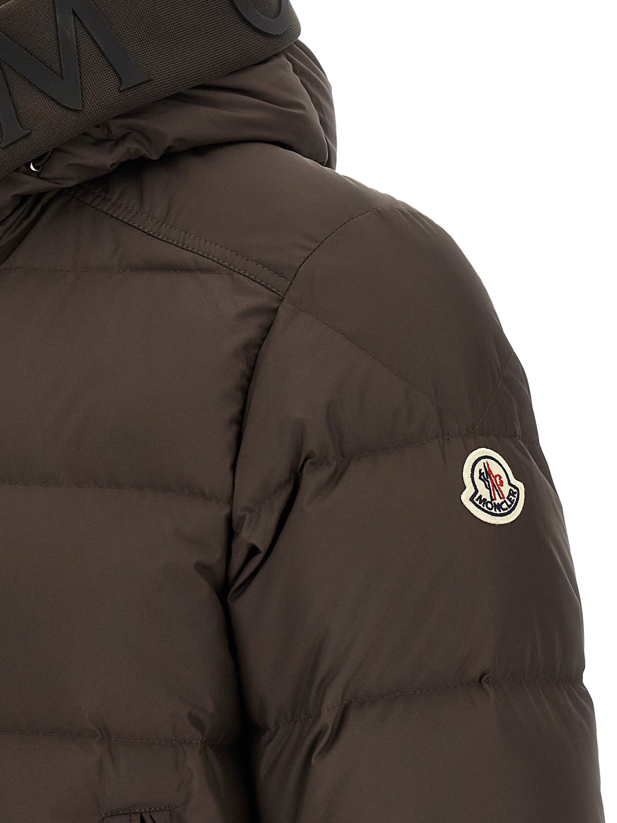 Experience the exquisite craftsmanship of the Moncler Brown Full-Length Down Jacket, a timeless piece that embodies luxury and sophistication for the discerning individual.