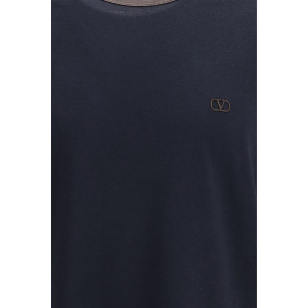 Indulge in the exquisite elegance of the Valentino Garavani Blue Cotton T-Shirt, crafted from 100% cotton for a refined, relaxed fit that embodies timeless luxury.