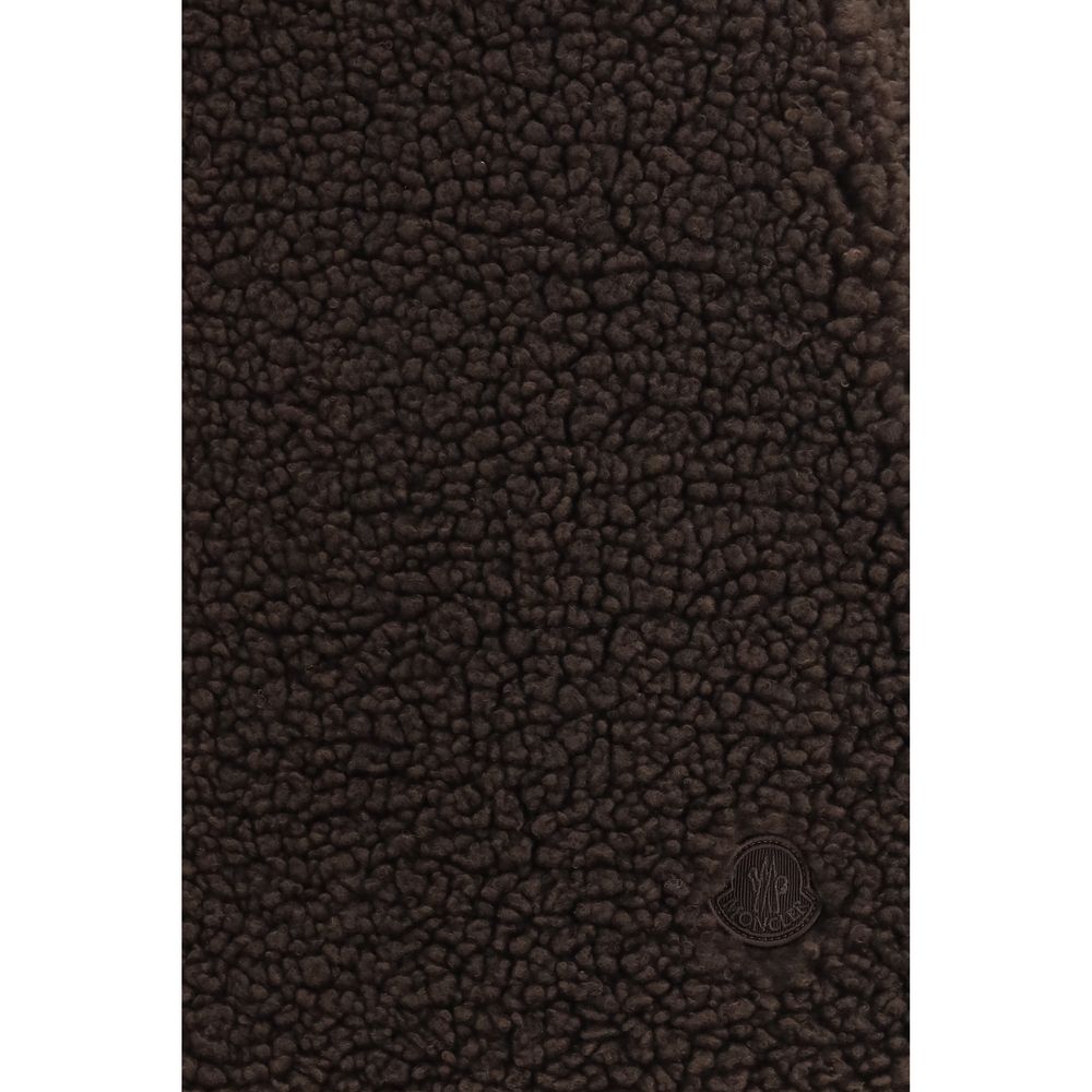 Elevate your wardrobe with the Moncler Teddy-Effect Brown Mini Skirt, a luxurious blend of plush fleece and sophisticated design, perfect for the discerning individual.