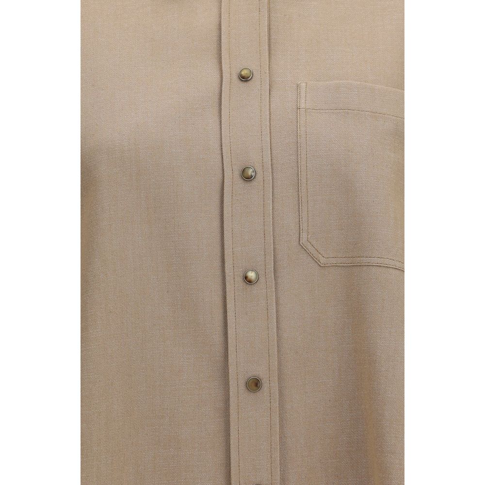 Discover the Brunello Cucinelli Beige Denim Shirt, a masterpiece of luxurious craftsmanship and elegant design, perfect for those who embody sophistication and style.