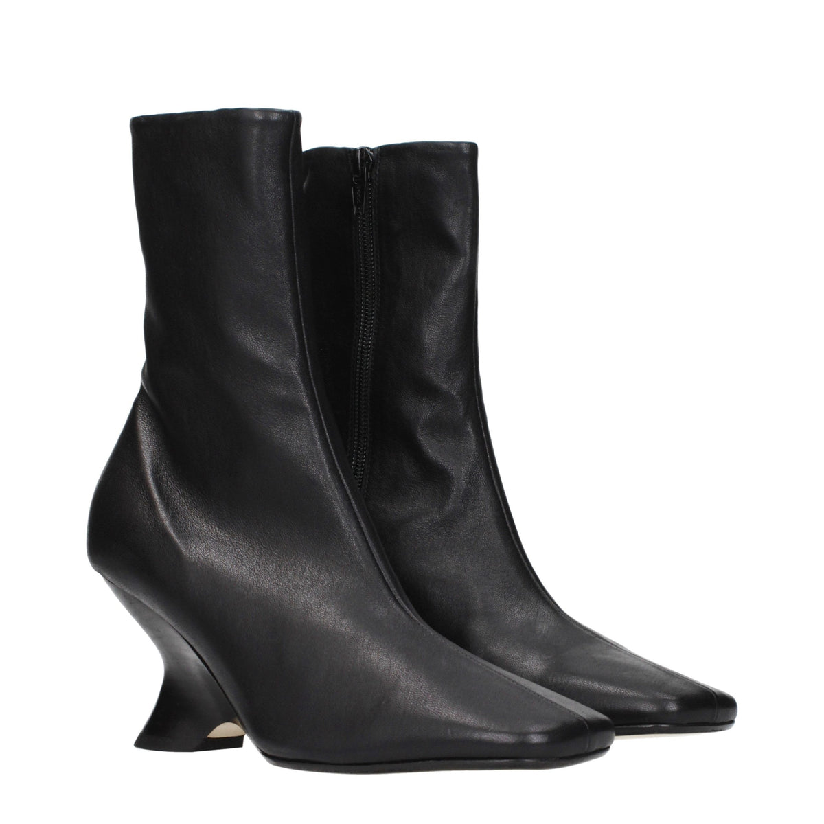 Elevate your style with Dries Van Noten's Black Leather Ankle Boots, where vintage allure meets modern sophistication, perfect for the discerning fashion connoisseur.