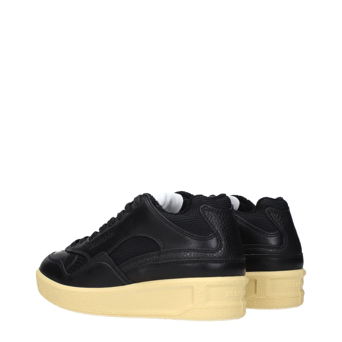 Indulge in the exquisite Jil Sander Black Leather Low Top Sneakers, where timeless elegance meets unparalleled craftsmanship, perfect for the discerning fashion connoisseur.