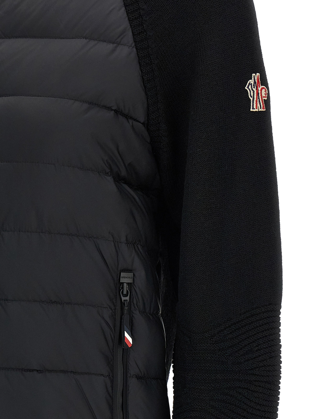 Experience the Moncler Grenoble Black Polyamide Cardigan, where exquisite craftsmanship meets unparalleled warmth, embodying luxury and sophistication for the discerning individual.