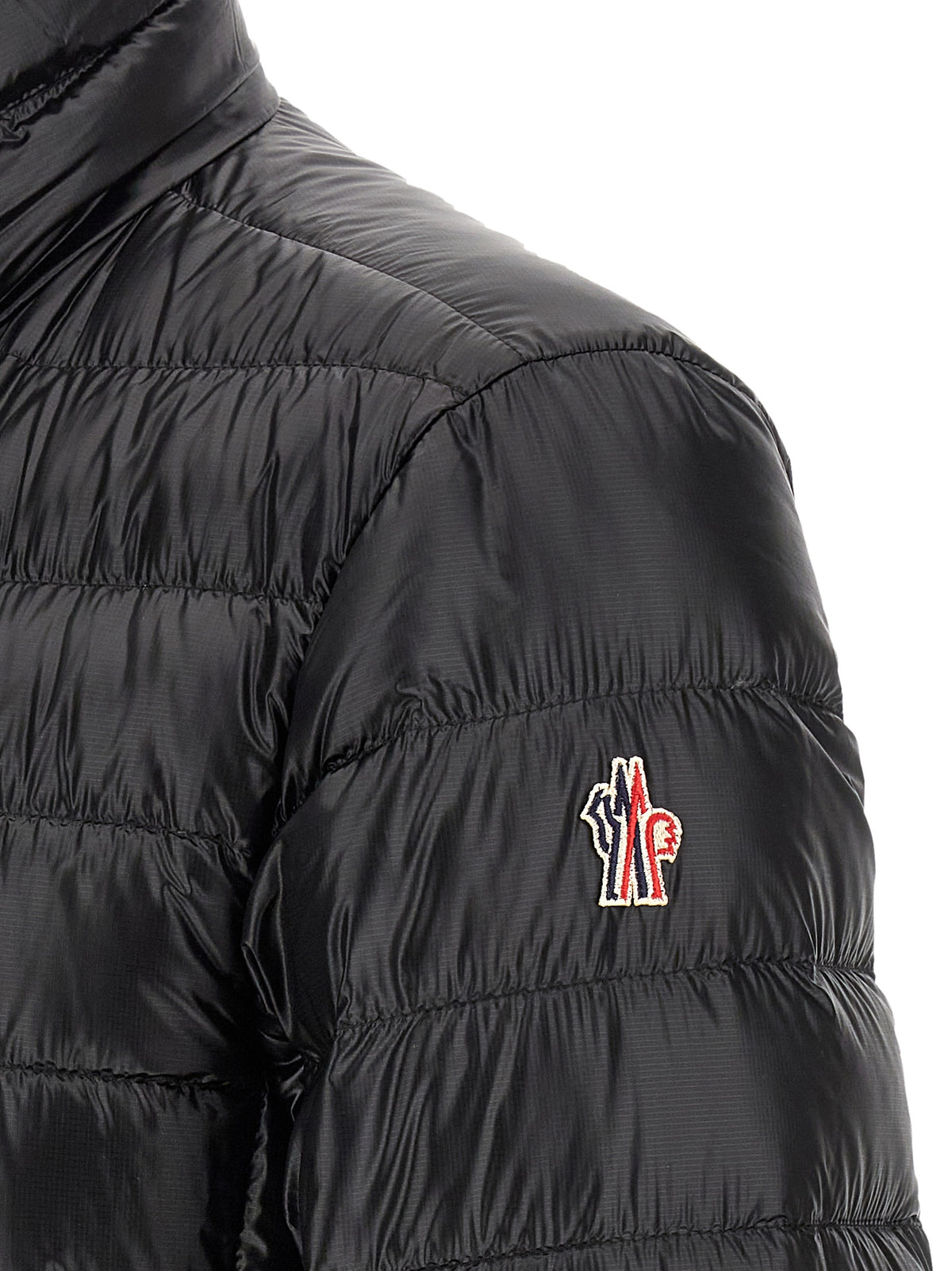 Discover the Moncler Grenoble Black Polyester Full-Length Jacket, a masterpiece of performance fashion that combines elegance and warmth for the discerning individual.