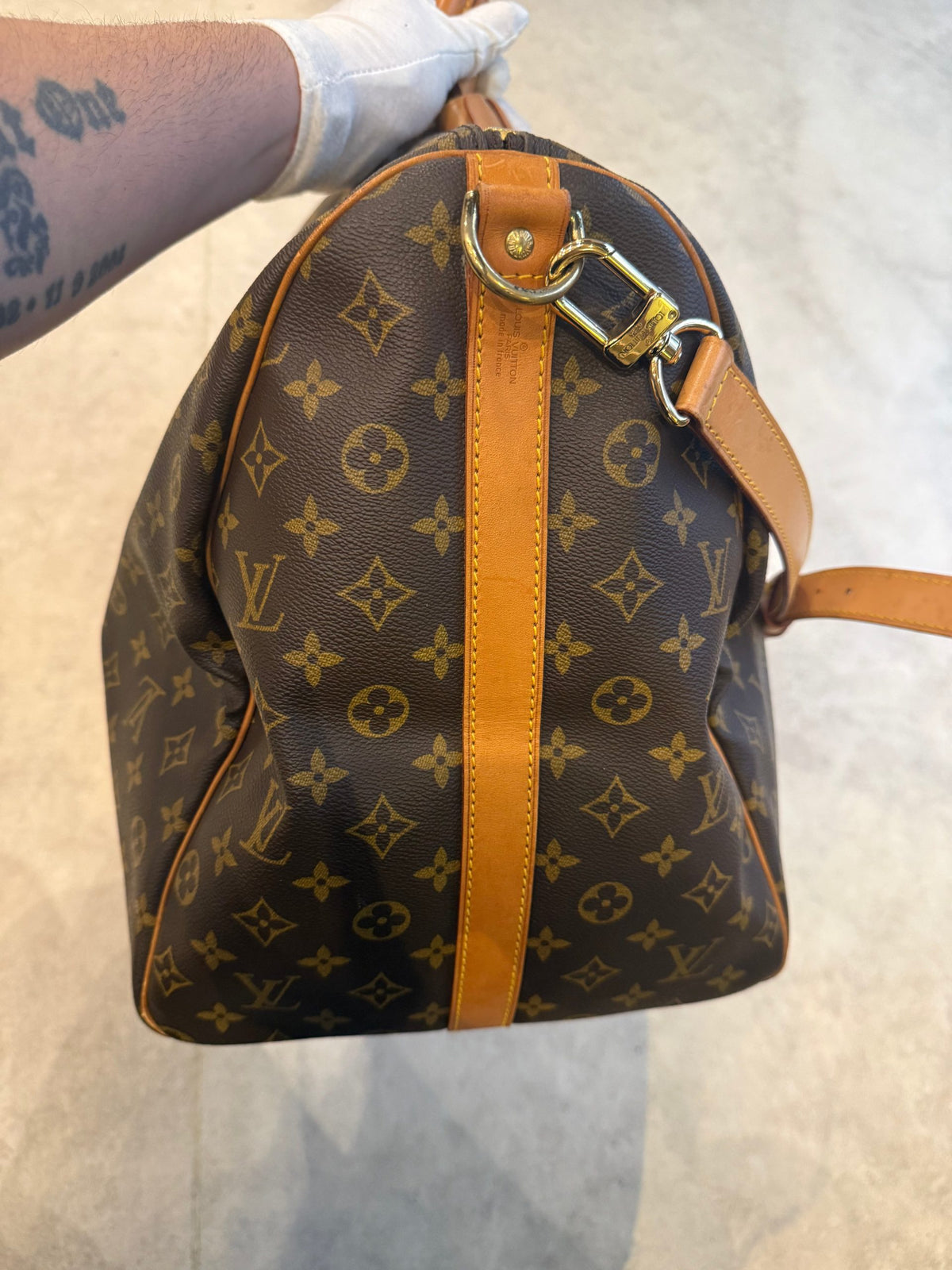 Elevate your essence with the Louis Vuitton KEEPALL 60 Monogram, a timeless duffel that embodies luxury, versatility, and exquisite craftsmanship for the discerning connoisseur.