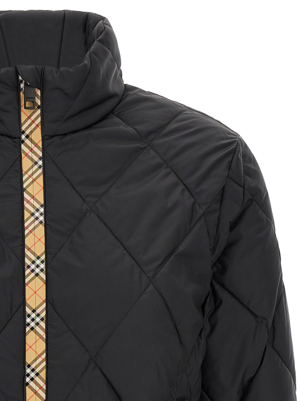 Indulge in the Burberry Bramford Black Polyamide Shell Jacket, where exquisite craftsmanship meets timeless elegance, elevating your outerwear with luxurious sophistication.