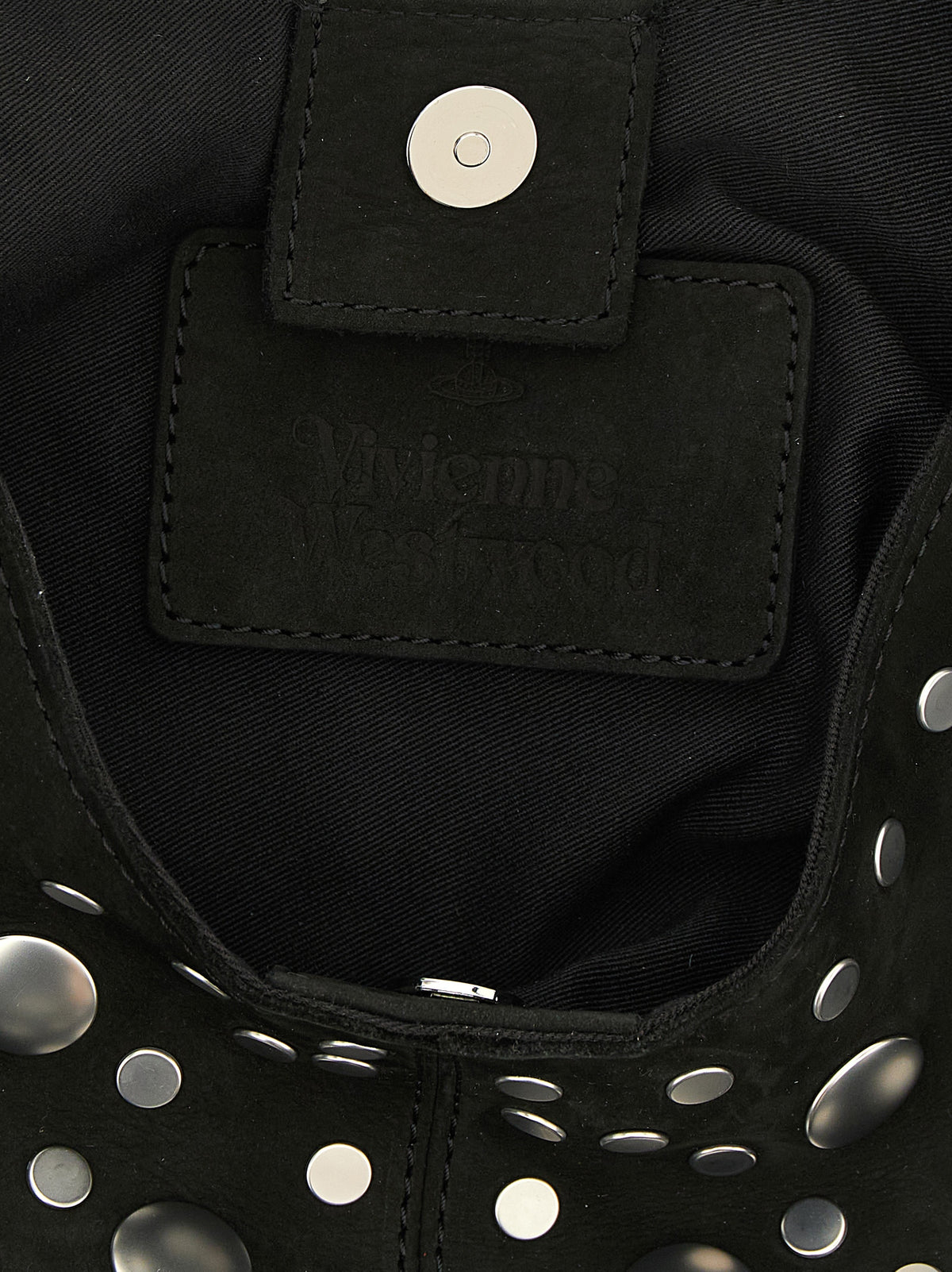 Discover the Vivienne Westwood ‘Ellie’ shoulder bag, a masterpiece of black cowhide and silver studs, embodying bold elegance and timeless luxury for the discerning individual.