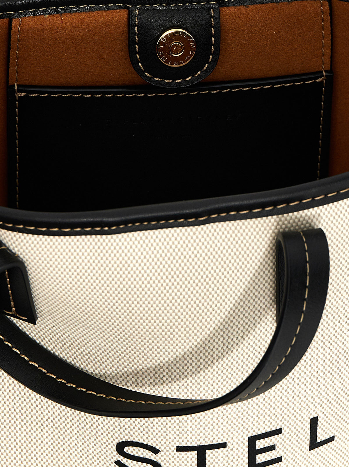 Elevate your style with the Stella McCartney Beige Polyamide Tote Bag, a masterpiece of sustainable luxury that embodies sophistication and modern chic.