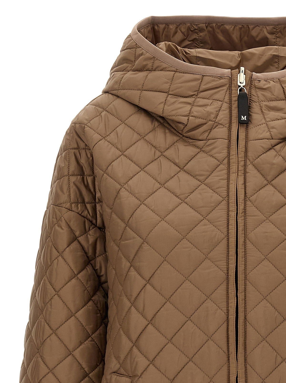 Discover the Max Mara Beige Polyester Shell Jacket, a masterpiece of reversible design and waterproof elegance, perfect for the discerning individual seeking timeless style.