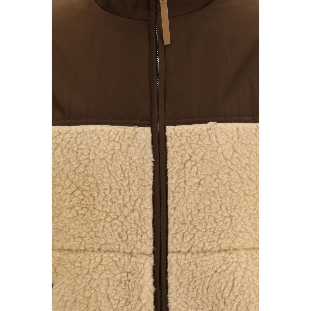 Indulge in the exquisite Ami Paris Beige Polyester Full-Length Jacket, where luxurious fleece meets refined nylon detailing, embodying sophistication and timeless elegance.