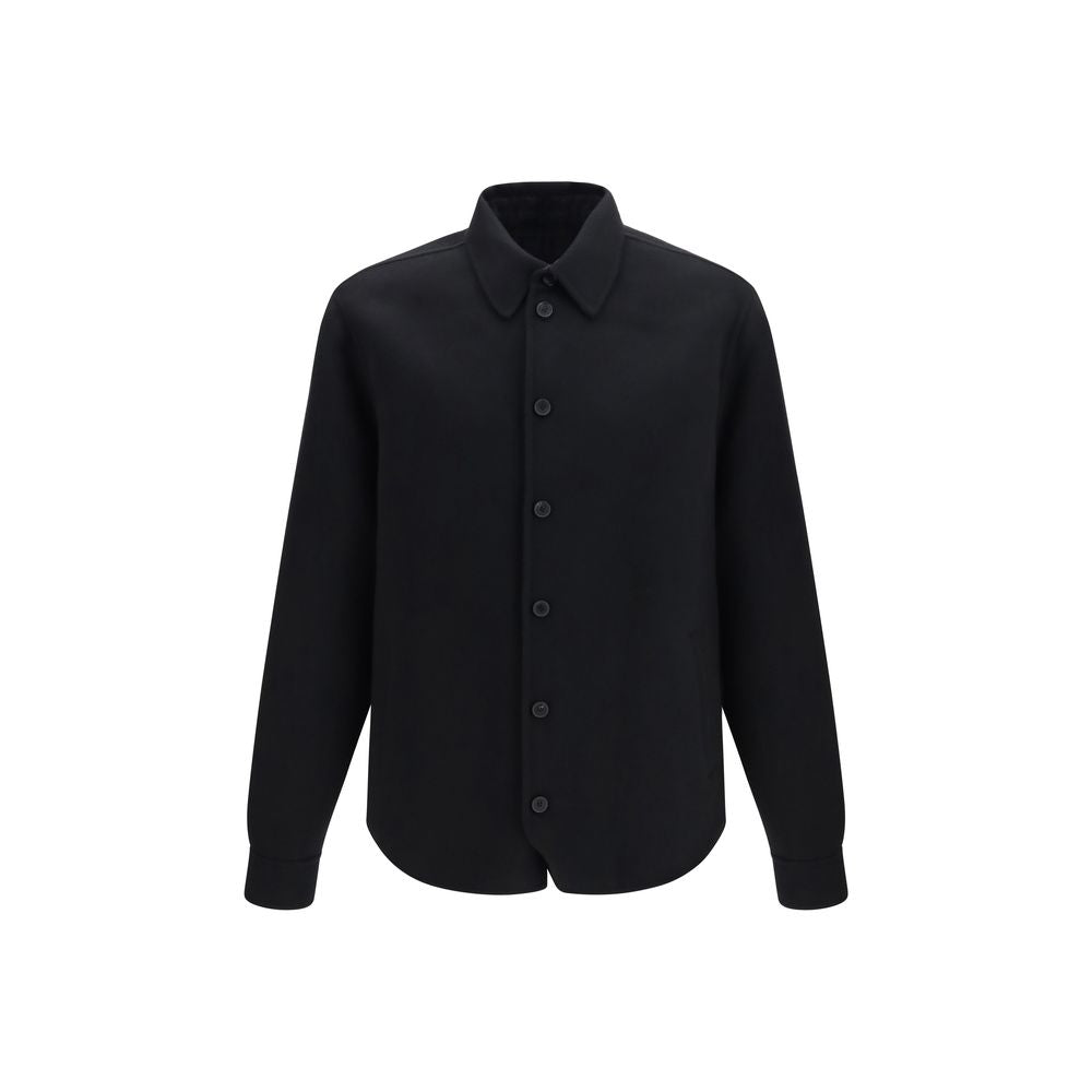 Indulge in the refined elegance of the Fendi Black Wool Oves Aries Jacket, crafted from luxurious double-faced virgin wool and silk, embodying timeless sophistication.