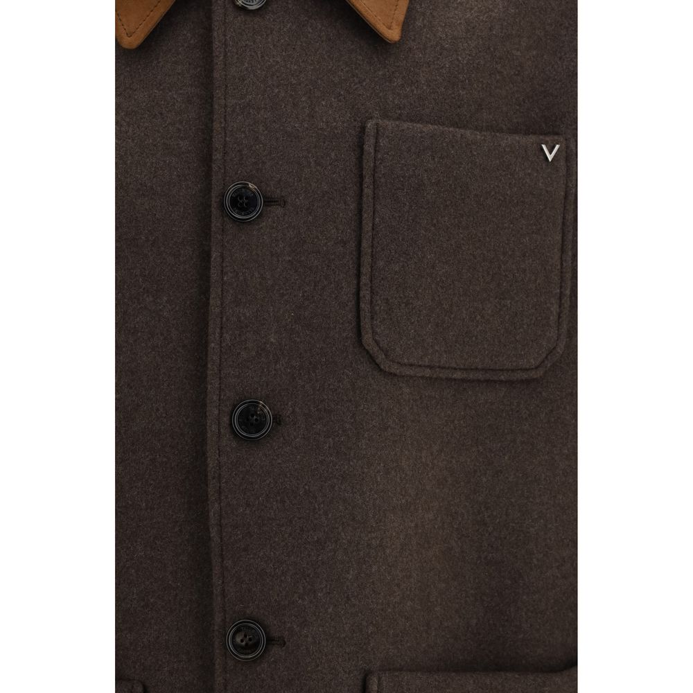 Indulge in the exquisite Valentino Garavani Brown Wool Oves Aries Full-Length Jacket, a masterpiece of 100% Merino wool and refined suede, embodying timeless elegance and sophistication.
