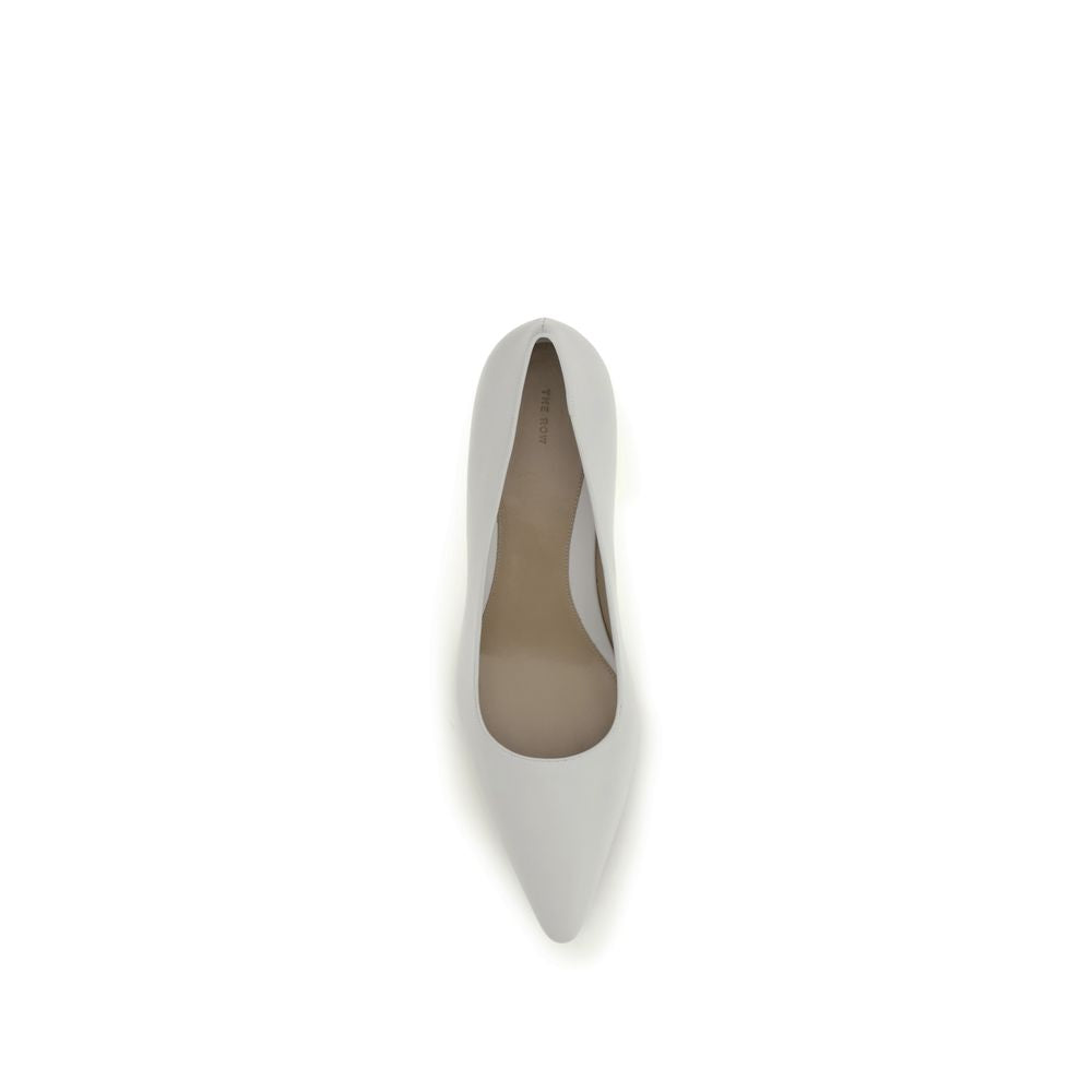 Indulge in the exquisite craftsmanship of The Row White Lamb Ovis Aries Platform Pumps, where soft lambskin meets a sophisticated silhouette, embodying timeless luxury.