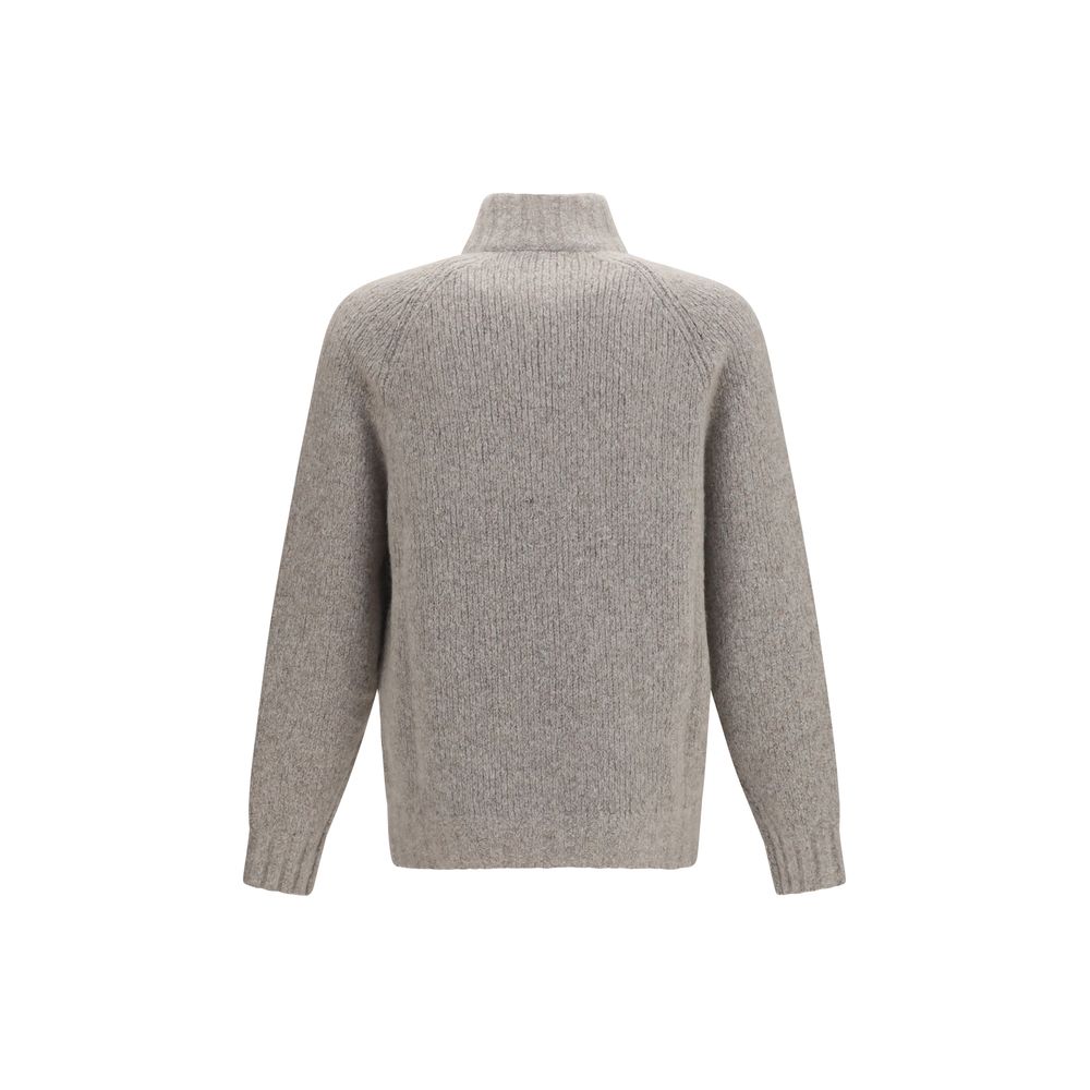 Indulge in the exquisite Brunello Cucinelli Gray Cashmere Cardigan, a luxurious blend of cashmere and silk, perfect for those who appreciate refined elegance and unparalleled craftsmanship.