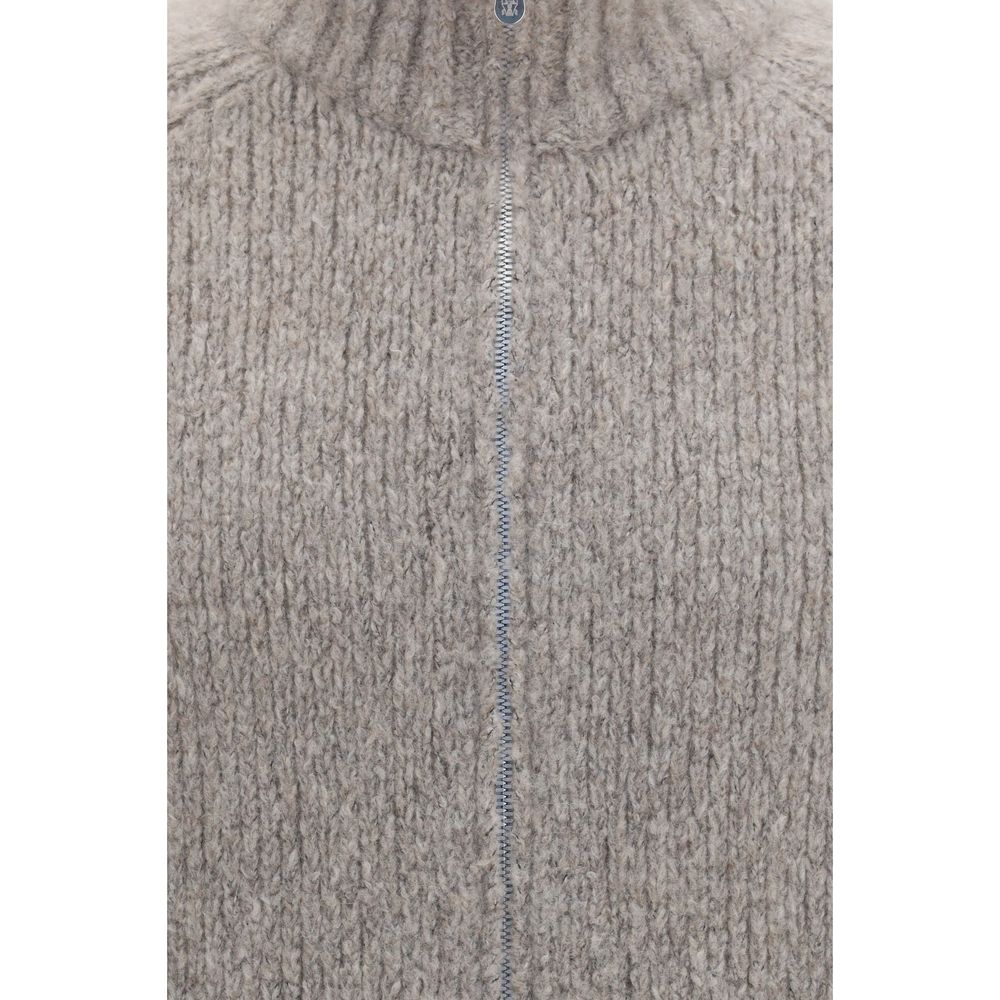 Indulge in the exquisite Brunello Cucinelli Gray Cashmere Cardigan, a luxurious blend of cashmere and silk, embodying refined elegance for the discerning individual.