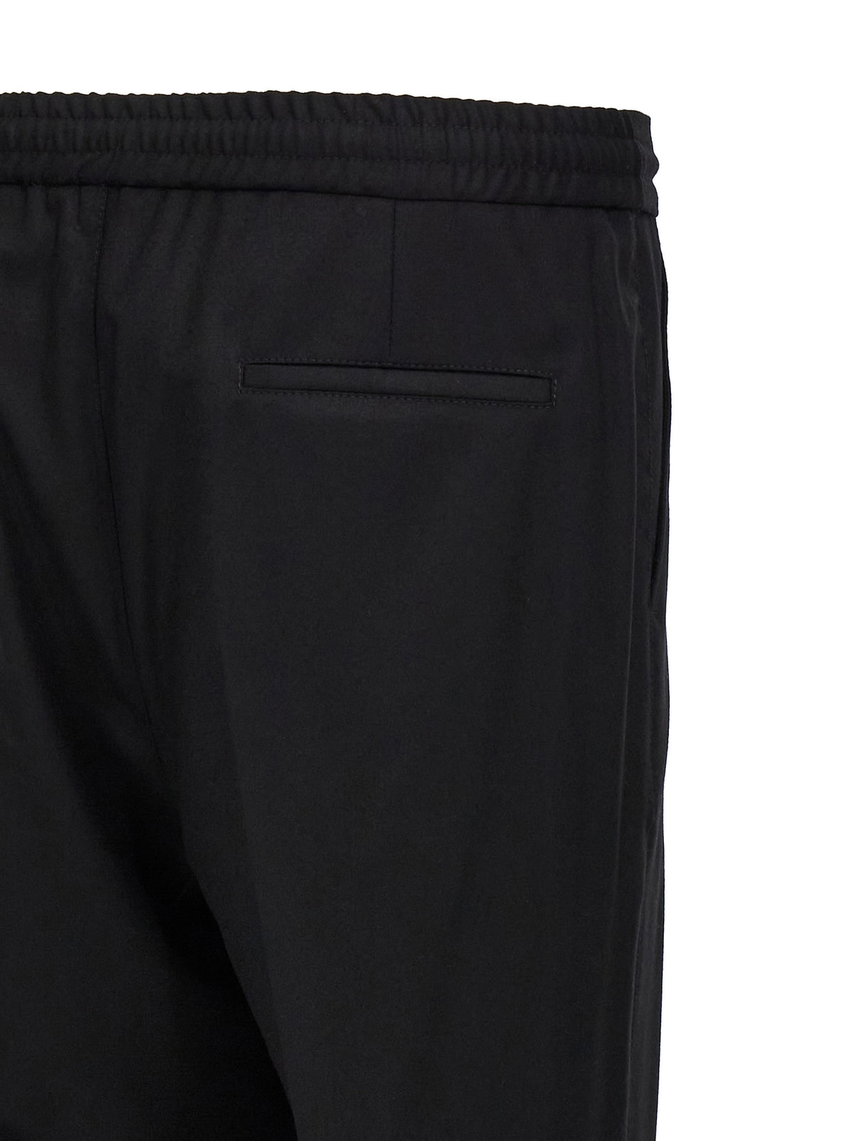Elevate your wardrobe with Brunello Cucinelli's Black Wool Casual Pants, where exquisite craftsmanship meets timeless elegance for the discerning individual.