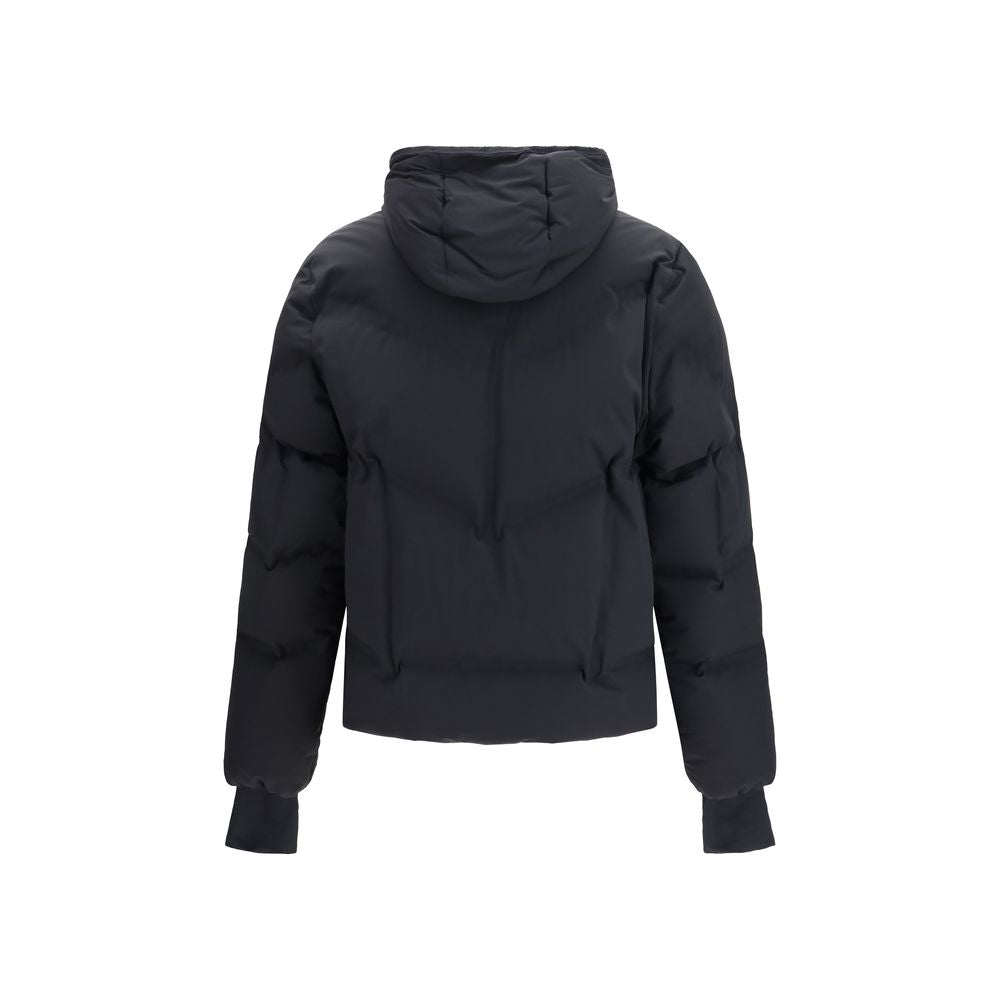 Indulge in the Moncler Grenoble Black Polyamide Full-Length Jacket, where exquisite craftsmanship meets alpine elegance, ensuring you conquer winter in style and luxury.