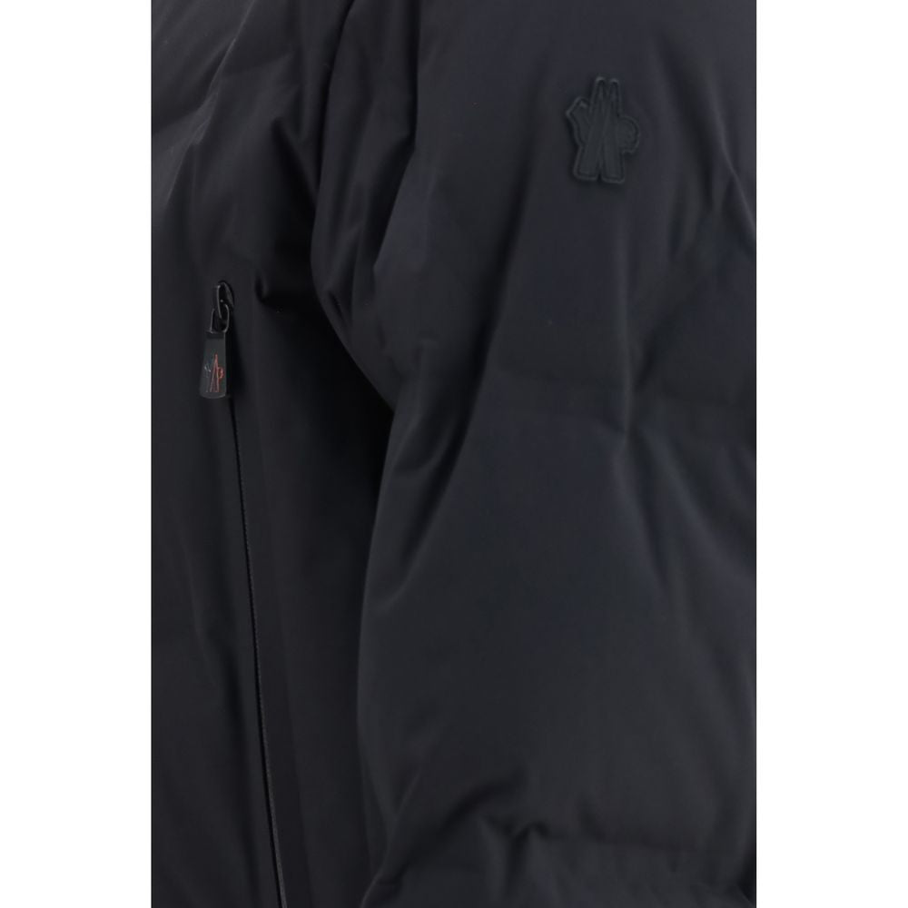 Elevate your winter wardrobe with the Moncler Grenoble Black Polyamide Full-Length Jacket, a masterpiece of luxury and performance, crafted for discerning adventurers.