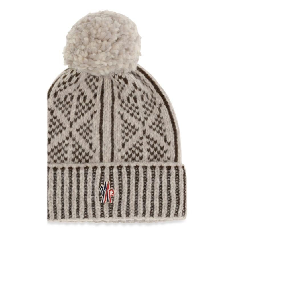 Elevate your winter elegance with the Moncler Grenoble Gray Alpaca Vicugna Pacos Beanie, a luxurious blend of alpaca and wool, crafted for those who appreciate timeless sophistication.