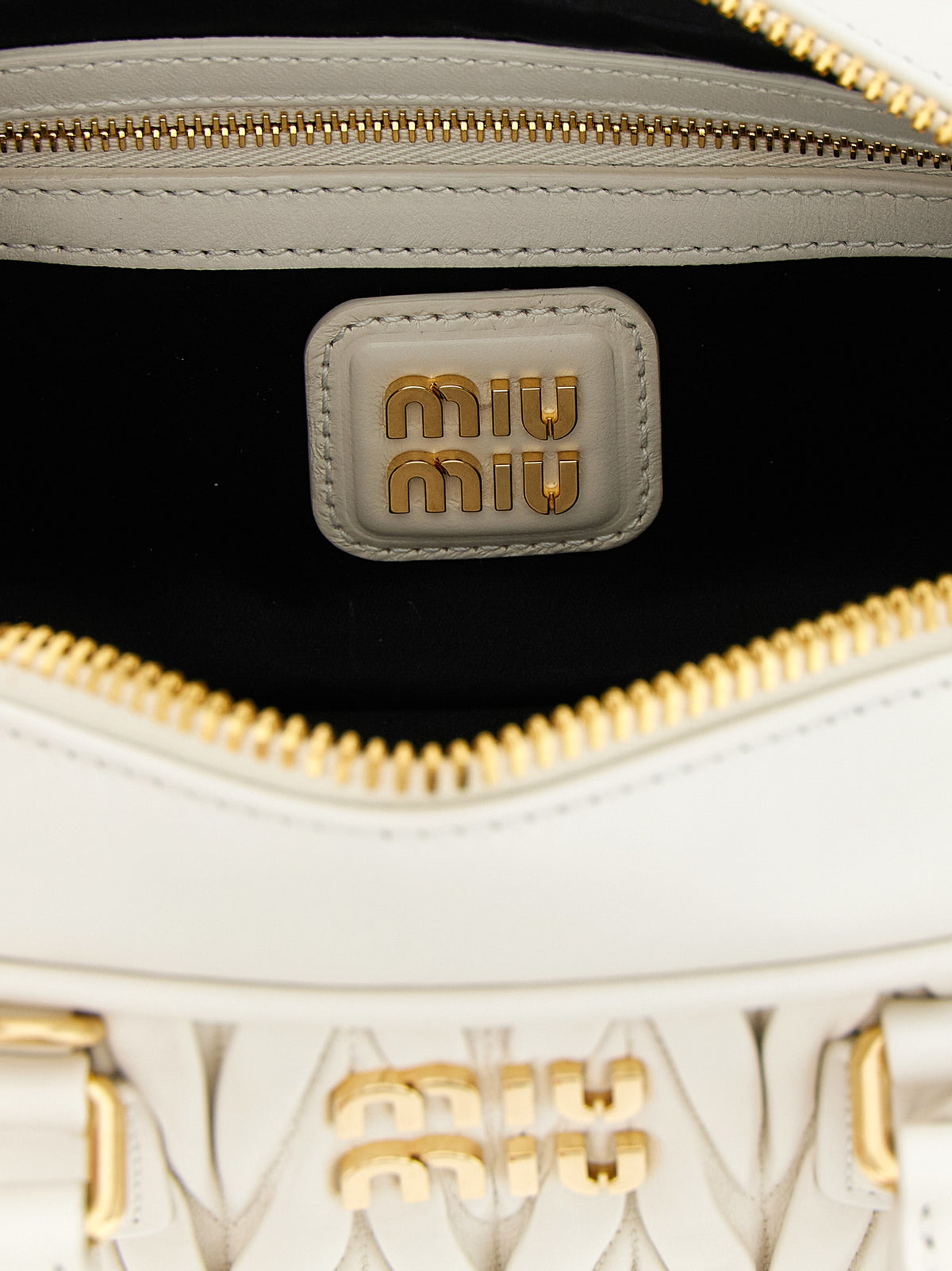 Discover the Miu Miu Arcadie White Leather Handbag, a masterpiece of Italian craftsmanship that embodies timeless elegance and sophistication for the discerning individual.