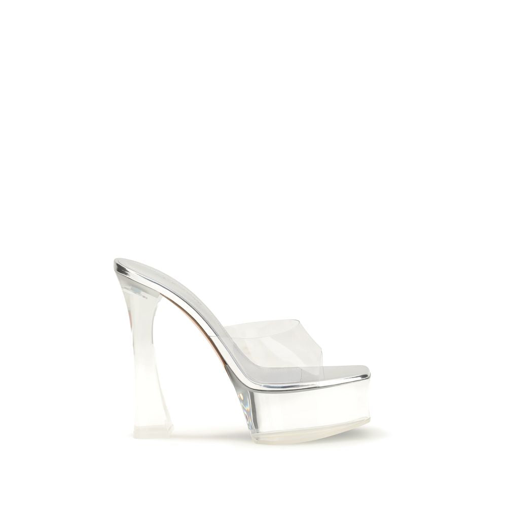Elevate your elegance with Amina Muaddi's Silver PVC Platform Sandals, where exquisite Italian craftsmanship meets a sculptural design, perfect for the discerning fashion connoisseur.