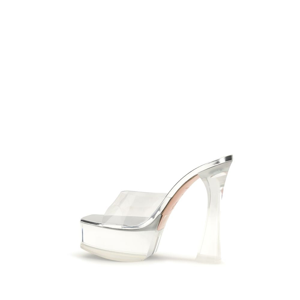 Step into a realm of elegance with Amina Muaddi's Silver PVC Platform Sandals, where Italian craftsmanship meets modern allure, perfect for the discerning connoisseur.