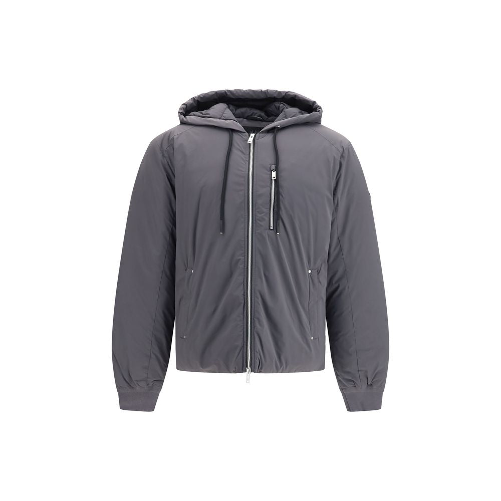 Elevate your winter wardrobe with the Moose Knuckles Gray Nylon Full-Length Jacket, where exquisite craftsmanship meets modern luxury for the discerning individual.