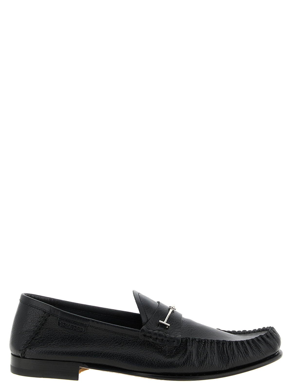Indulge in the exquisite craftsmanship of Tom Ford's Black Goatskin Slip-On Loafers, where luxurious goat leather meets timeless elegance, perfect for the discerning individual.