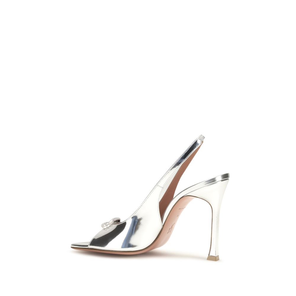 Elevate your style with Amina Muaddi Silver Calf Leather Bos Taurus Sandals, where exquisite craftsmanship meets luxurious design, perfect for any sophisticated occasion.