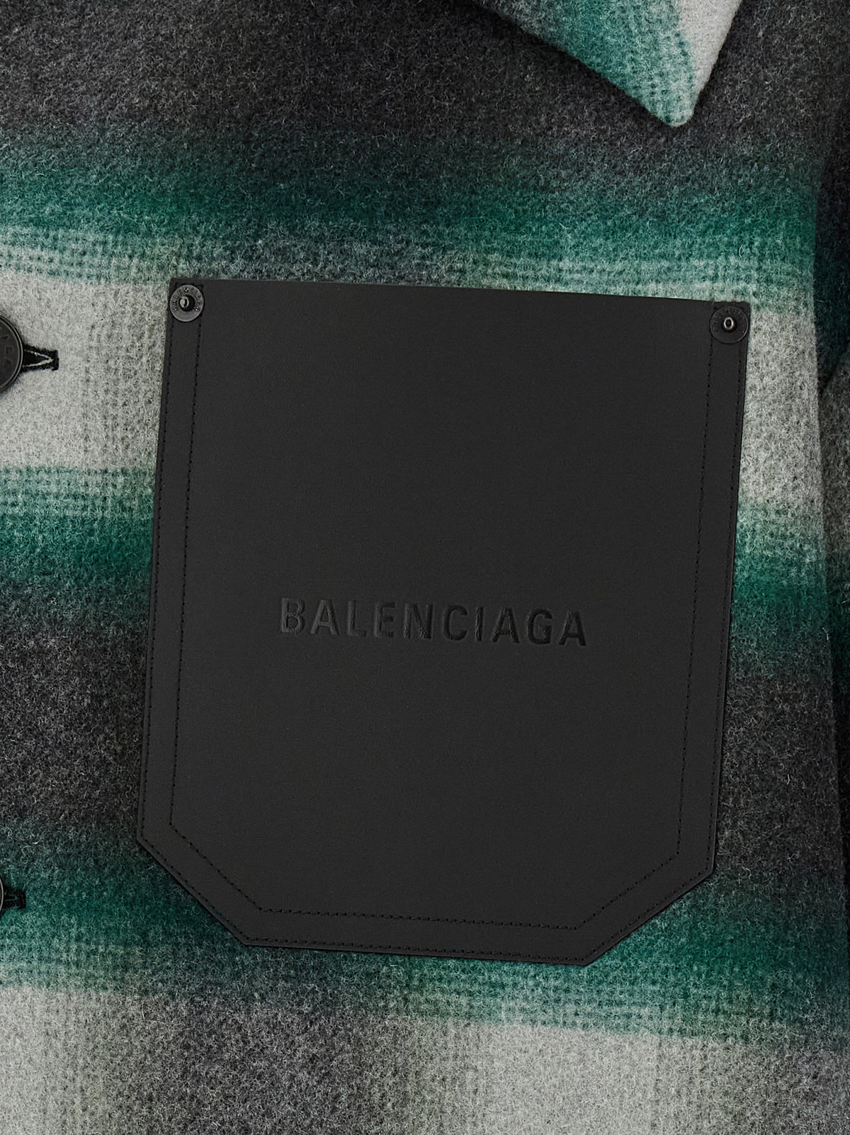 Discover the Balenciaga Bicolor Wool Full-Length Jacket, a masterpiece of Italian craftsmanship in luxurious wool flannel, redefining modern elegance for the discerning wardrobe.