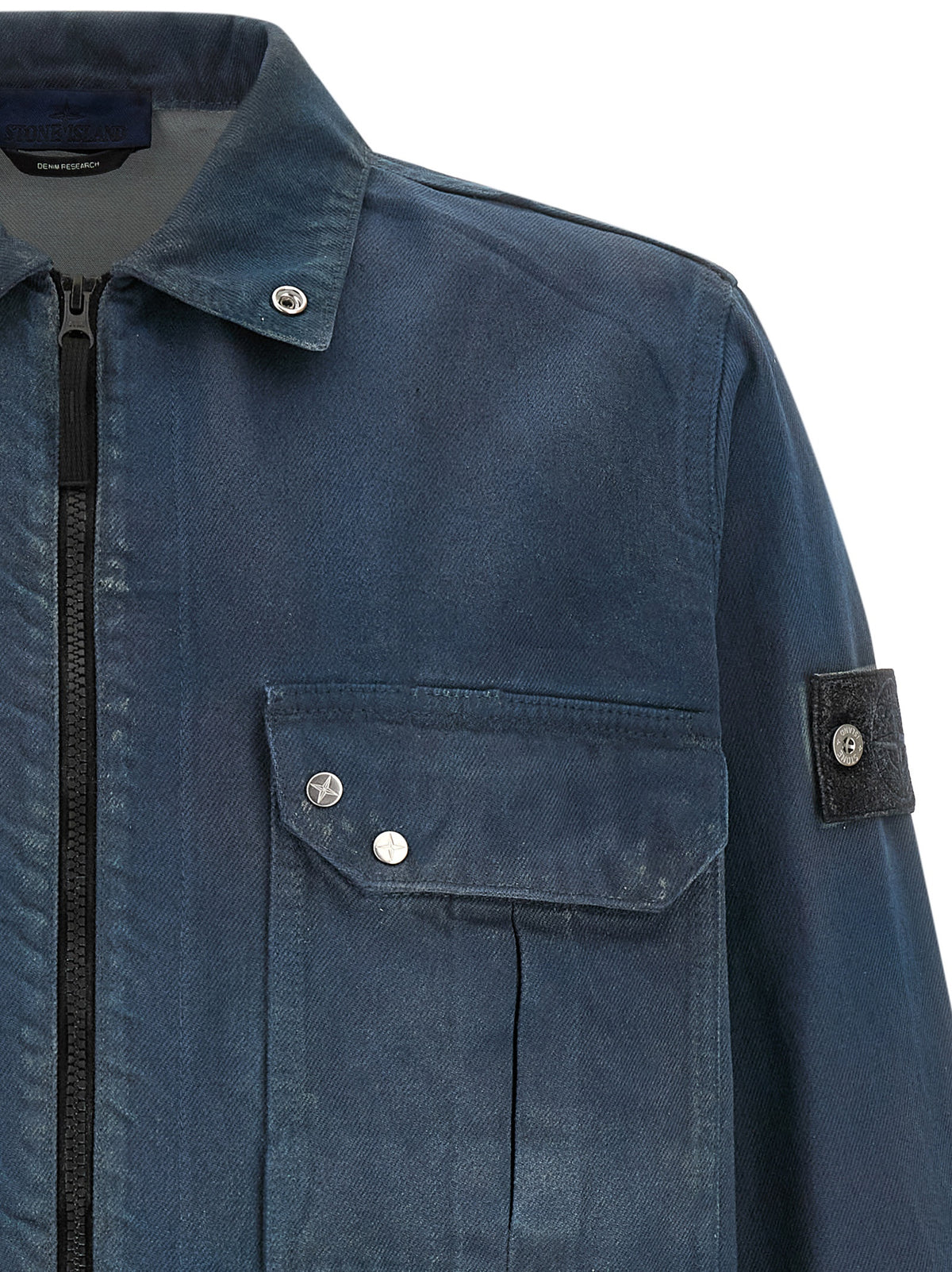 Discover the Stone Island Blue Cotton Blouse, a masterful blend of utilitarian elegance and supreme comfort, crafted for those who appreciate refined style and sophistication.