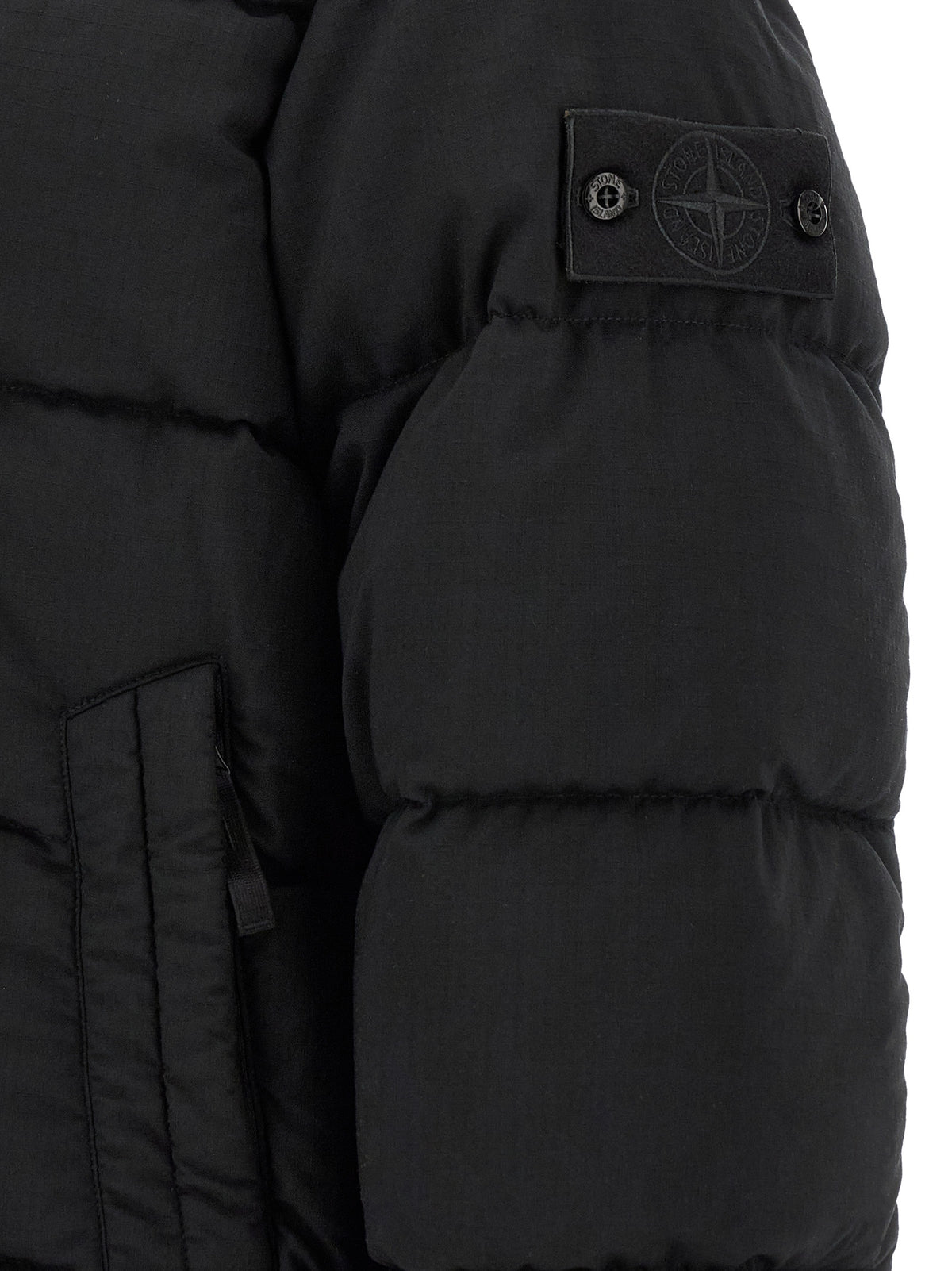 Elevate your winter wardrobe with the Stone Island Black Virgin Wool Full-Length Jacket, crafted from premium virgin wool for unparalleled luxury and sophistication.