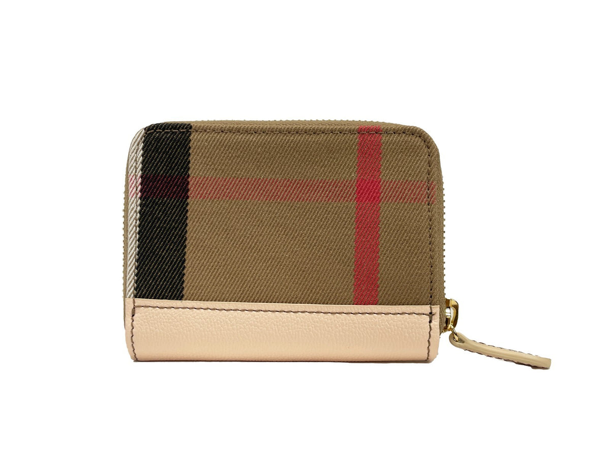 Discover the Burberry MN Zip Around Check Coin Wallet, a luxurious blend of canvas and leather, epitomizing timeless elegance and exquisite craftsmanship for the discerning individual.